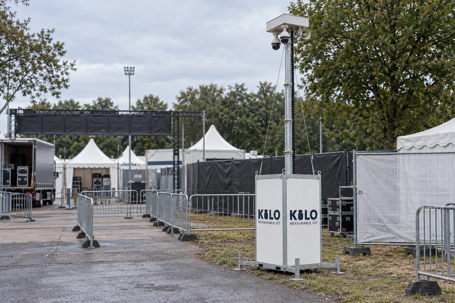 Kilo tower beside event fencing and temporary tents